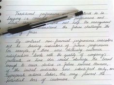 a pen sitting on top of a piece of paper next to an open notebook with writing