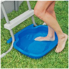 a woman standing on top of a blue potty