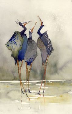 two birds standing next to each other in the water