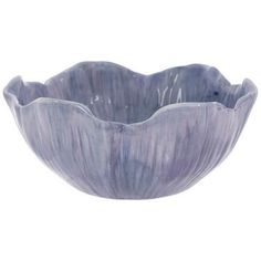 a blue bowl sitting on top of a white table