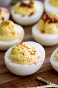 deviled eggs on a wooden cutting board