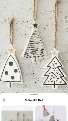 three wooden christmas trees hanging from strings on a wall with text overlay that reads, more like this