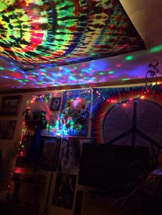 the ceiling is decorated with colorful lights and pictures