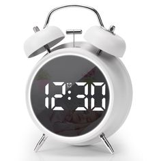 an alarm clock with the digital time displayed on it's face is shown in front of a white background