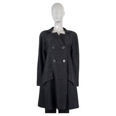 100% authentic Chanel double breasted tweed coat in black cotton (70%) and polyester (30%). Features a stand collar, logo buttons on the front and a buttoned belt in the back. Lined in silk (100%). Has been worn and is in excellent condition. 2016 Paris-Seoul Resort Measurements Model Chanel16C P52965 K39572 Tag Size 38 Size S Shoulder Width 40cm (15.6in) Bust From 92cm (35.9in) Waist From 112cm (43.7in) Hips From 134cm (52.3in) Length 96cm (37.4in) Side Seam Length 70cm (27.3in) Sleeve Length 6 Tweed Coat, Double Breasted Coat, Chanel Black, Outerwear Coats, Stand Collar, Black Cotton, Seoul, Double Breasted, Coats Jackets