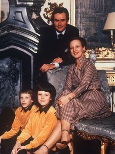 a family posing for a photo in their home