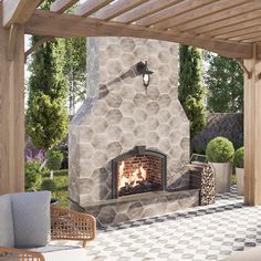 an outdoor fireplace in the middle of a patio