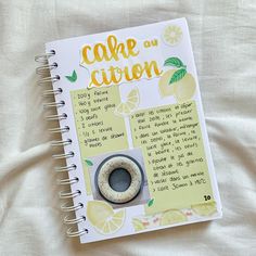 a recipe book with lemons on it and a ring in the middle that says cale citron