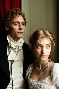 a man and woman dressed in period clothing