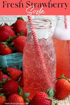 two mason jars filled with liquid and strawberries next to each other on a table