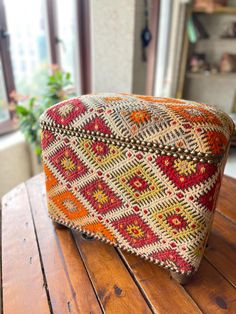 a small bag sitting on top of a wooden table