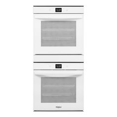 two white ovens side by side on a white background