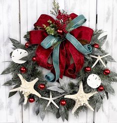 a christmas wreath with starfishs and decorations