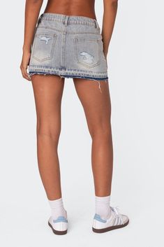 Online only! This Edikted denim mini skirt is the ultimate go-to piece for all your spring/summer plans. This classic staple with distressed detailing will go with everything in your closet, so you'll never be left wondering what to wear.


	Mini skirt
	Dual color distressed hem
	Distressed detailing
	Denim fabric
	100% Cotton
	Model wears size S
	Model height is 5'11
	Item care: Wash with similar color Denim Blue Cotton Cutoff Mini Skirt, Trendy Denim Blue Cutoff Skort, Trendy Cutoff Denim Blue Skort, Denim Blue Mini Skort With Frayed Hem, Denim Blue Skort With Frayed Hem, Medium Wash Mini Length Skort For Summer, Casual High Rise Distressed Mini Skirt, Summer Medium Wash Mini Length Skort, Medium Wash Cotton Cutoff Mini Skirt