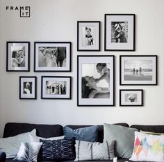 a living room filled with lots of pictures and framed photos on the wall above it