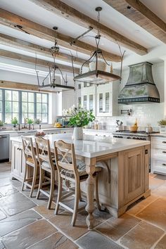 a large kitchen with an island in the middle