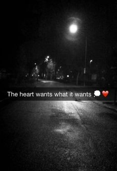 an empty street at night with the words'the heart wants what it wants '