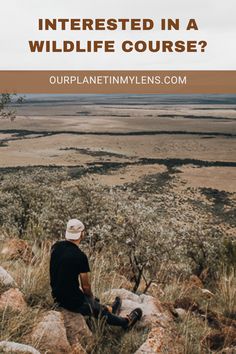 a man sitting on top of a rock with the words interested in a wildlife course?