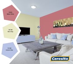 a living room with white furniture and pink walls