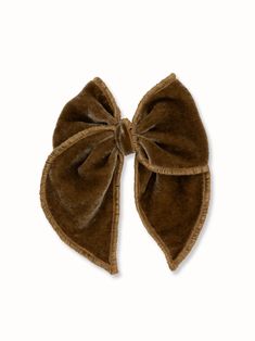 The perfect accessory for everyday or party looks. A versatile and classic piece. Luxurious Silk Royal Velvet fabric in bronze gold color. Silver-tone alligator clip. The bow measures approximately 4.5 x 5.0 inches * Due to the nature of our handmade bows each bow may look slightly different. * This hair accessory is not a toy, we recommend not to play with it. It may contain small parts that potentially could be dangerous to small children, please supervise your child while wearing our hair acc Silk Bow, Book Launch, Brown Silk, Bronze Gold, Large Bow, Handmade Bows, Party Looks, Velvet Fabric, Hair Accessory