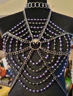 Spiders! Purple and black pearls make up this extra large spider web. Attached to a choker & belt and a couple if spider charms for a finishing touch.  Perfect for a rave or a fun evening out! Spider Web Fashion Runway, Armor Core, Punk Jewelry Diy, Spider Choker, Armor Jewelry, Spider Web Necklace, Rave Jewelry, Harness Fashion, Spider Jewelry