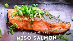 a piece of meat with green onions on it and the words easy 10 minute miso salmon