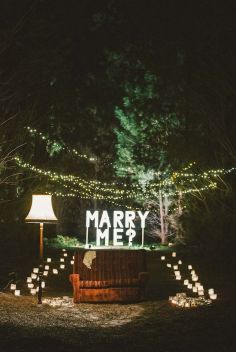 a sign that reads 5 top tips for planning the perfect proposal with candles around it