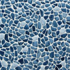 a blue and white mosaic tile pattern that looks like it has been made out of rocks