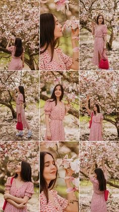 a woman in a pink dress standing under a tree with lots of blossoms on it