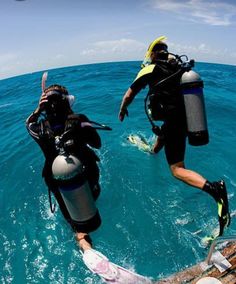 two people in the water with scuba gear