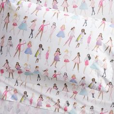 this is a bed sheet with barbie dolls on it