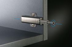 an image of a door handle with blue arrows pointing in the opposite direction to it