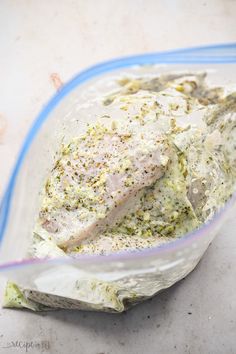 a plastic bag filled with food sitting on top of a counter