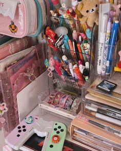 an organized desk with pens, pencils and other items