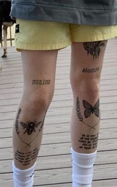 the legs of a person with tattoos on them