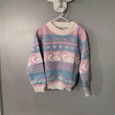 Vintage Child's Pastel Cat Sweater size 2T-3T Very good condition  Tag says 2 which I'm assuming means size 2. This looks a bit larger though like it would Fit closer to a 3 or 4 year old. Please check measurements with similar Article of clothing. 14" pit to pit  Approx 15" long Arms are approx 14" (measuring from end o sleeve to seam at shoulder/pit)  Shoulder seam to seam is 12" wide. Very good vintage condition Cat Sweater, Cute Pastel Sweaters, Cheap Kawaii Cotton Sweater, Vintage Animal Sweater, Vintage Cat Sweater, Vintage Cat Sweatshirt, Pastel Sweater, Tissue Box Covers, Vintage Children