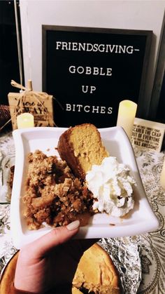 a person holding a plate with some food on it