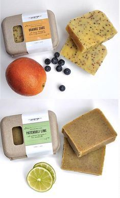 soap bars, oranges and blueberries are arranged on a white surface next to an orange