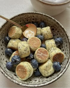 a bowl filled with blueberries and other fruit