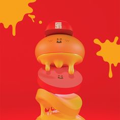 a stack of different colored objects on top of each other in front of a red background