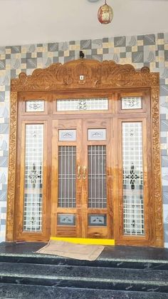 two wooden doors sitting next to each other in front of a wall with checkered walls