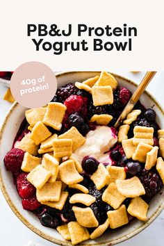 a bowl filled with fruit and cereal on top of a table