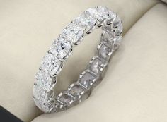 a large diamond ring sitting on top of a couch