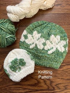 two knitted hats and balls of yarn on a wooden surface with the words knitting pattern