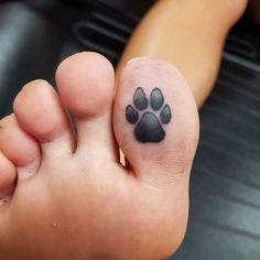 a person with a dog paw tattoo on their foot and the caption reads, daily treat