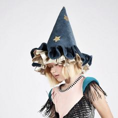 This witch's/wizard's hat, with ruffle details, is very stylish indeed. It is crafted from blue velvet, with gold lamé and gold glitter stars and moons. An essential accessory for Halloween, or to add to a dressing up box for imaginative play any time of the year. The hat is made from soft blue velvet It has ruffle details on the brim made from blue velvet and shiny gold lamé It has a blue velvet elastic strap with a hook and loop fastener Gold glitter stars and moons add a delightful embellishm Kirby Gijinka, Stars And Moons, Gold Glitter Stars, Authentic Models, Barbie Movie, Meri Meri, Glitter Stars, Blue Hat, Turbans