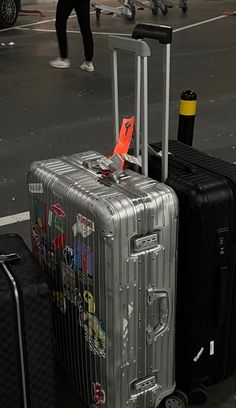 two pieces of luggage sitting on the ground