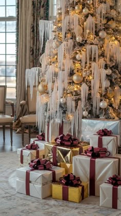 a christmas tree with presents under it