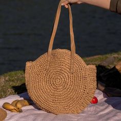 Introducing our Round Straw Bag - the epitome of summer chic and beach vibes. This rattan beach tote bag, also known as the Bali Bag, is the perfect accessory to elevate your style and bring a touch of bohemian charm to any outfit. Shape and Style: The bag's round shape adds a unique and trendy element to your look, making it a standout piece wherever you go. Its boho-inspired design is perfect for beach days, vacations, or casual outings, giving you that relaxed and carefree feel. Versatile Sho Lightweight Brown Bohemian Beach Bag, Bohemian Lightweight Beach Bag For Vacation, Bohemian Large Capacity Straw Bag For Daily Use, Bohemian Lightweight Jute Beach Bag, Bohemian Lightweight Crochet Beach Bag, Chic Beach Bag Made Of Natural Fiber, Chic Summer Bags Made Of Natural Fiber, Bohemian Lightweight Brown Straw Bag, Lightweight Bohemian Brown Straw Bag