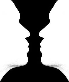 the silhouettes of two people are shown in black and white, with one man's face partially obscured by his shadow